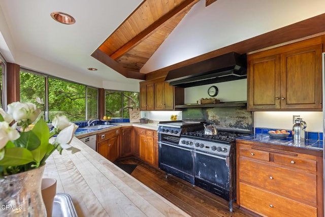 kitchen featuring range hood, gas stove, a sink, dark wood finished floors, and brown cabinetry