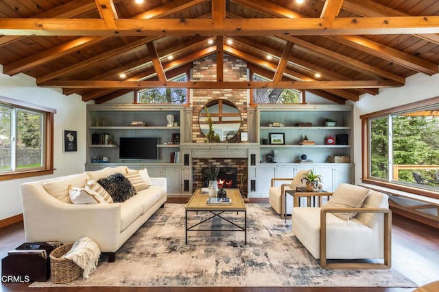 living area with wood ceiling, wood finished floors, a fireplace, built in features, and baseboards