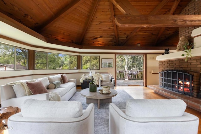 living room with wooden ceiling, wood finished floors, and a fireplace
