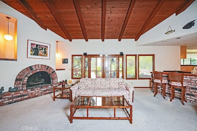carpeted living area featuring wood ceiling and a fireplace
