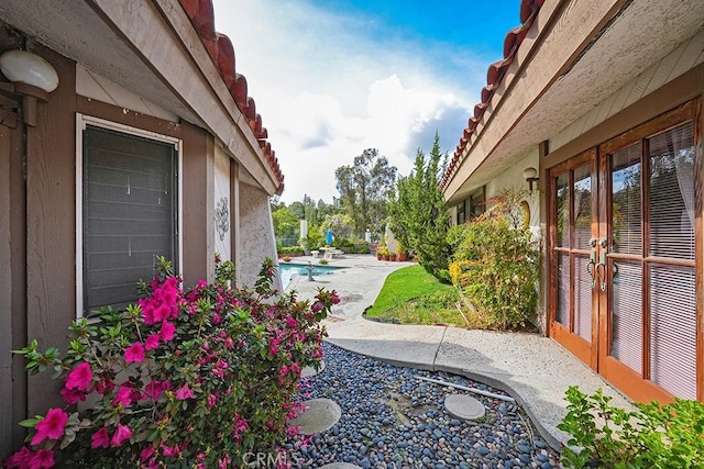 view of yard featuring french doors