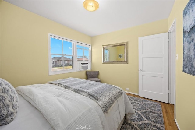 333 W Andrix St, Monterey Park, CA 91754 - bedroom featuring wood finished floors, baseboards, and cooling unit