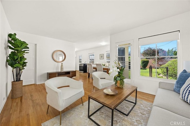 333 W Andrix St, Monterey Park, CA 91754 - living room featuring plenty of natural light, light wood-style floors, and baseboards