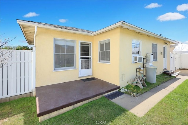 333 W Andrix St, Monterey Park, CA 91754 - view of home's exterior featuring stucco siding, fence, a patio area, and cooling unit