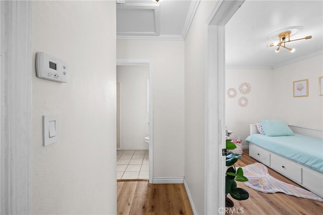 5927 Mckinley Ave, South Gate, CA 90280 - bedroom featuring crown molding and wood finished floors