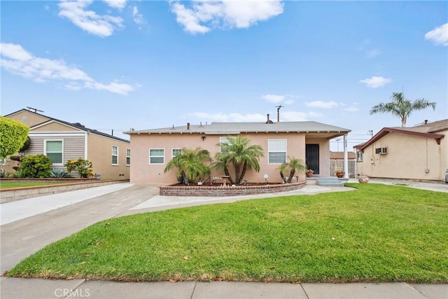 5927 Mckinley Ave, South Gate, CA 90280 - view of front facade with stucco siding and a front yard