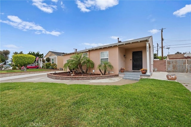 5927 Mckinley Ave, South Gate, CA 90280 - view of front facade featuring stucco siding