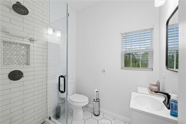 5927 Mckinley Ave, South Gate, CA 90280 - full bath featuring a stall shower, vanity, tile patterned floors, toilet, and baseboards