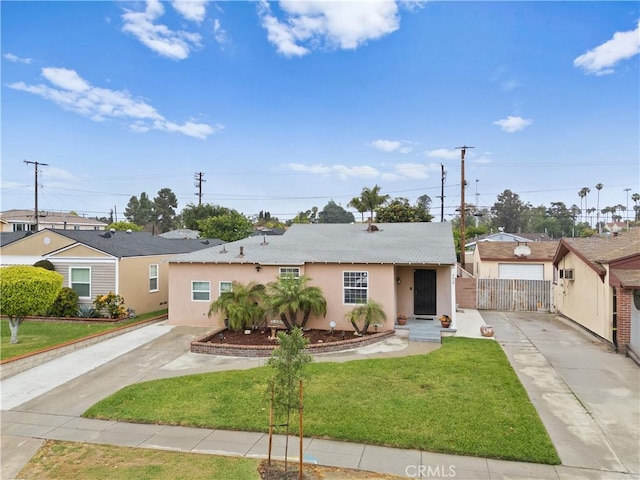 5927 Mckinley Ave, South Gate, CA 90280 - single story home featuring stucco siding, driveway, and a front lawn