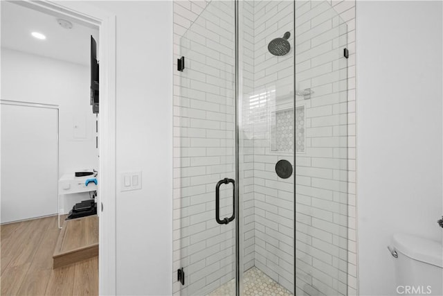 5927 Mckinley Ave, South Gate, CA 90280 - bathroom featuring wood finished floors, a stall shower, toilet, and recessed lighting