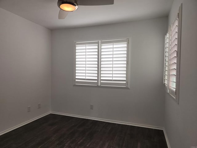 600 N The Strand Unit 12, Oceanside, CA 92054 - empty room with ceiling fan, dark wood-style floors, and baseboards