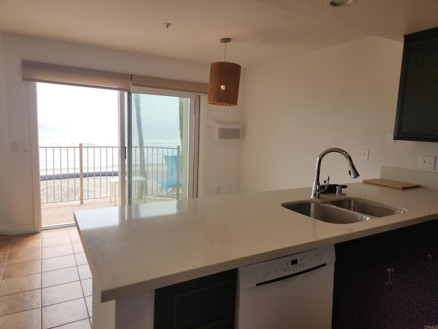 600 N The Strand Unit 12, Oceanside, CA 92054 - kitchen featuring dishwasher, a sink, light tile patterned floors, light countertops, and pendant lighting
