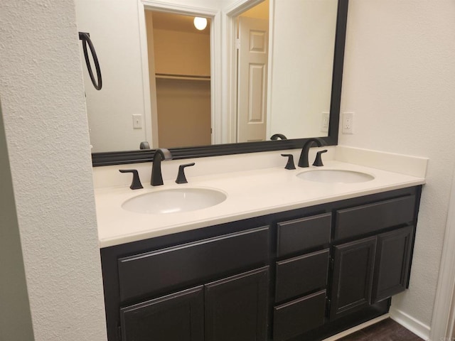 600 N The Strand Unit 12, Oceanside, CA 92054 - full bath with double vanity and a textured wall