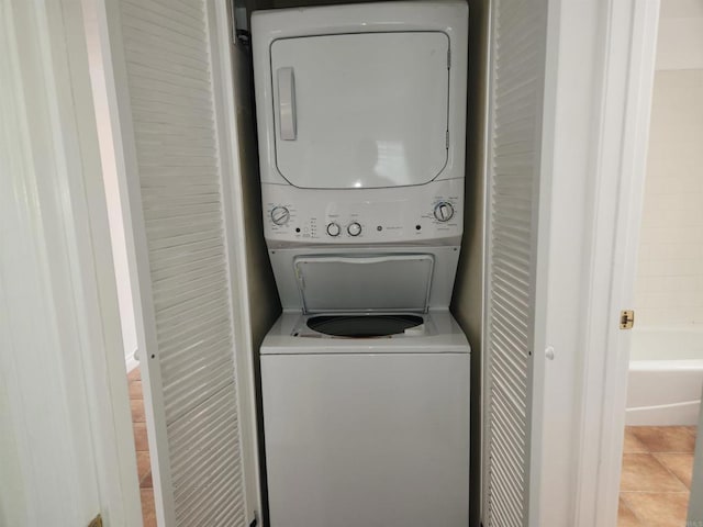 600 N The Strand Unit 12, Oceanside, CA 92054 - laundry area with estacked washer and dryer and tile patterned flooring