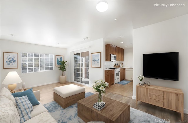 25892 Iris Ave Unit A, Moreno Valley, CA 92551 - living room with light wood-style floors and baseboards