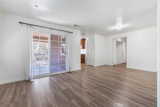 25892 Iris Ave Unit A, Moreno Valley, CA 92551 - unfurnished room with wood finished floors and baseboards