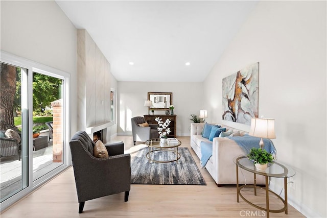 27751 Via Lorca, Mission Viejo, CA 92692 - living area with light wood finished floors, high vaulted ceiling, baseboards, and recessed lighting