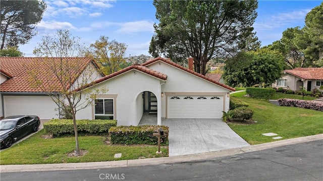 27751 Via Lorca, Mission Viejo, CA 92692 - mediterranean / spanish home with an attached garage, a tiled roof, stucco siding, and a front yard