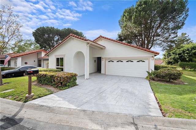 27751 Via Lorca, Mission Viejo, CA 92692 - mediterranean / spanish-style house featuring a garage, a front yard, stucco siding, driveway, and a tiled roof