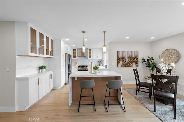 27751 Via Lorca, Mission Viejo, CA 92692 - kitchen featuring stainless steel appliances, light countertops, tasteful backsplash, white cabinetry, and recessed lighting