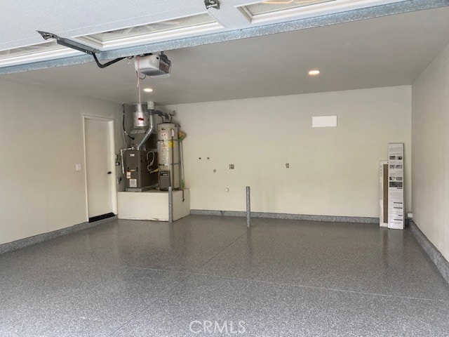 27751 Via Lorca, Mission Viejo, CA 92692 - garage with strapped water heater, a garage door opener, heating unit, baseboards, and recessed lighting