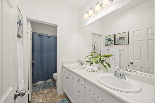 full bath featuring toilet, double vanity, and curtained shower