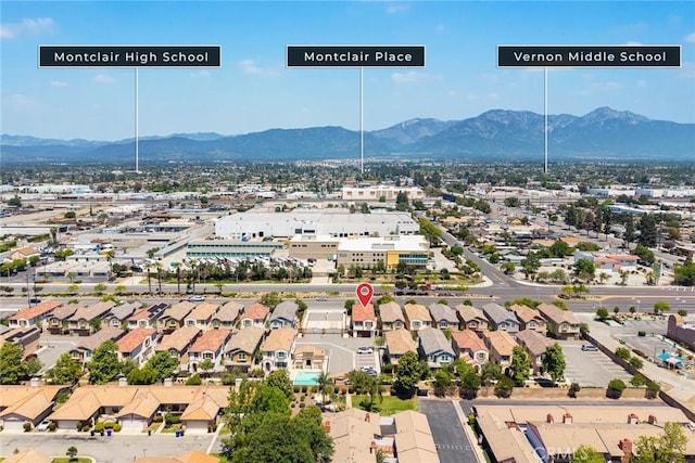 aerial perspective of suburban area with a mountainous background