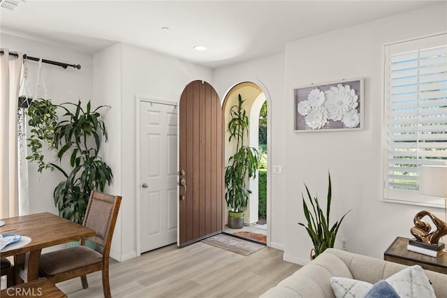 entrance foyer featuring light wood-style floors, recessed lighting, and baseboards