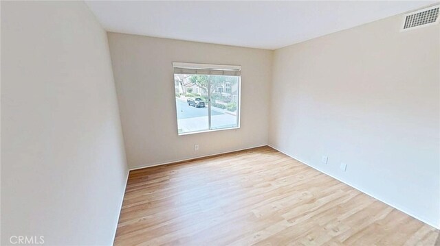 137 Corsica Dr, Newport Beach, CA 92660 - empty room with light wood-style flooring and baseboards