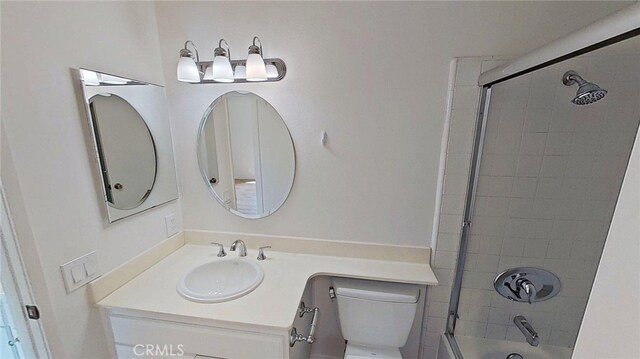 137 Corsica Dr, Newport Beach, CA 92660 - bathroom with toilet, vanity, and combined bath / shower with glass door
