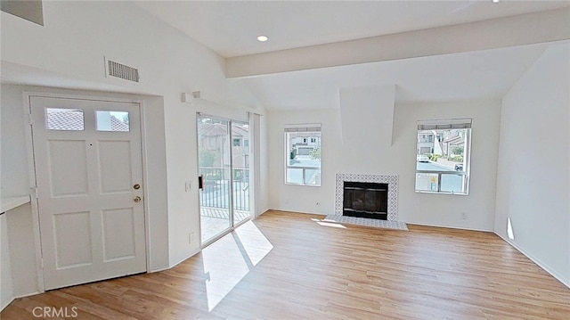 137 Corsica Dr, Newport Beach, CA 92660 - foyer with light wood-type flooring, a tile fireplace, and recessed lighting