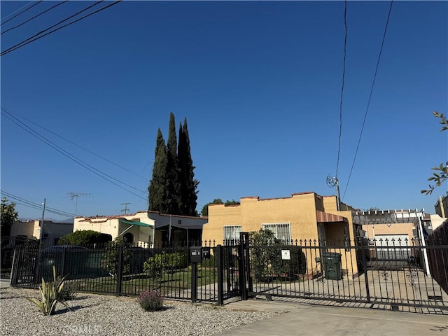 1828A New Ave, San Gabriel, CA 91776 - view of front of property with a fenced front yard, stucco siding, and a gate