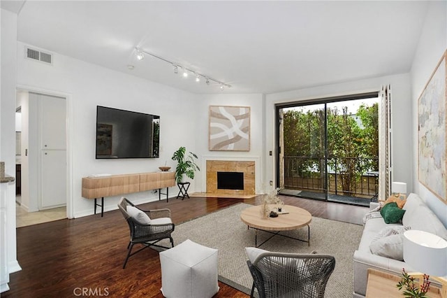 18600 Clark St Unit 102, Tarzana, CA 91356 - living room featuring wood finished floors, rail lighting, and a premium fireplace