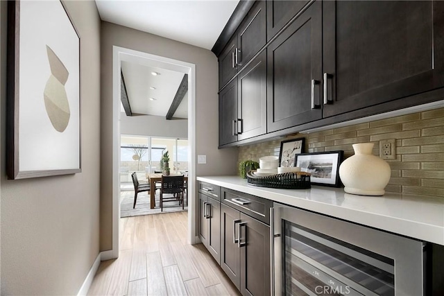 16402 Ginger Creek Dr, Riverside, CA 92504 - bar area with wine cooler, backsplash, and light wood-type flooring