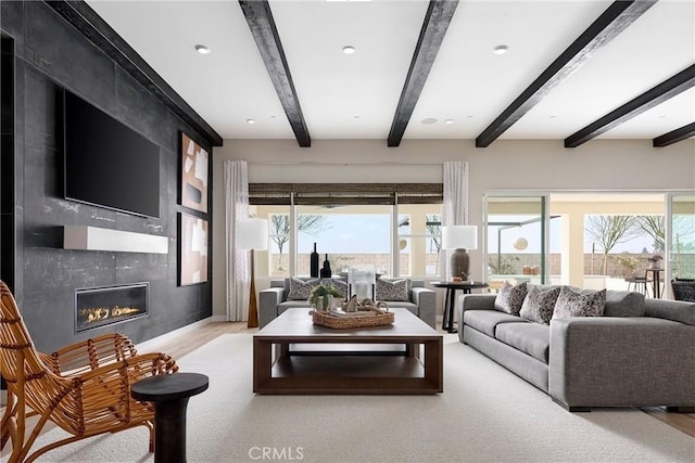 16402 Ginger Creek Dr, Riverside, CA 92504 - living room with beamed ceiling, a fireplace, and wood finished floors