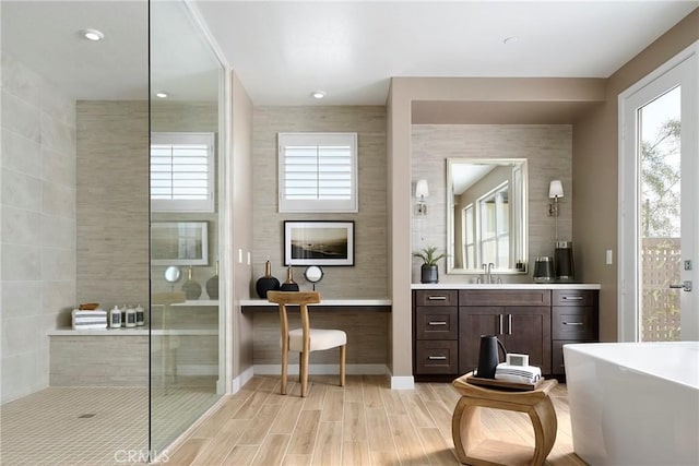 16402 Ginger Creek Dr, Riverside, CA 92504 - full bath with vanity, a soaking tub, healthy amount of natural light, and walk in shower