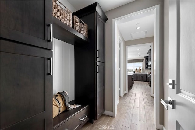 16402 Ginger Creek Dr, Riverside, CA 92504 - mudroom featuring baseboards and light wood-style flooring