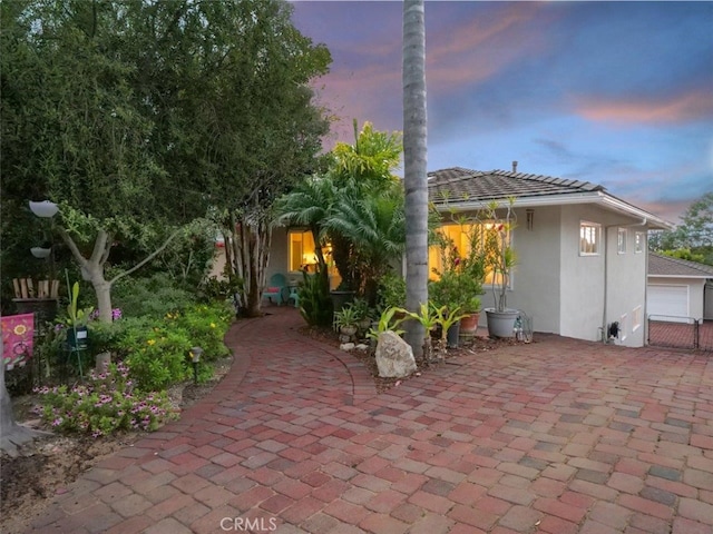 1621 Espinosa Cir, Palos Verdes Estates, CA 90274 - back of property at dusk with stucco siding