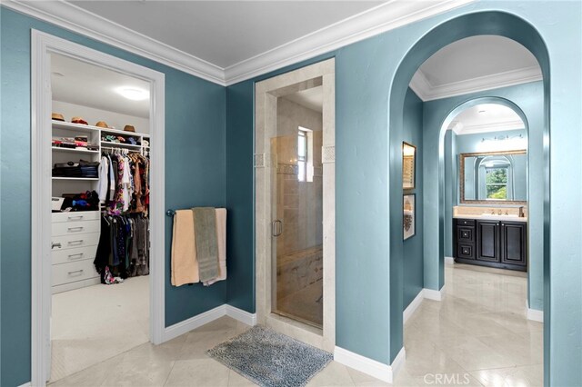 15020 Applewood Ct, San Diego, CA 92131 - bathroom featuring crown molding, vanity, a stall shower, a spacious closet, and baseboards
