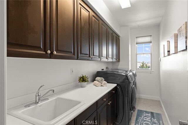 15020 Applewood Ct, San Diego, CA 92131 - laundry room with cabinet space, washer and clothes dryer, and baseboards