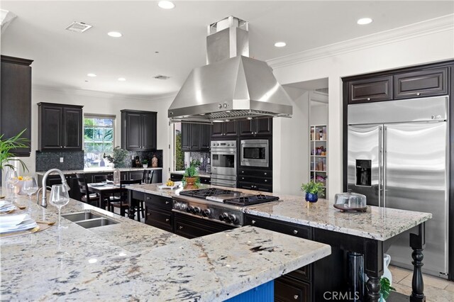 15020 Applewood Ct, San Diego, CA 92131 - kitchen with built in appliances, island range hood, a spacious island, a sink, and tasteful backsplash