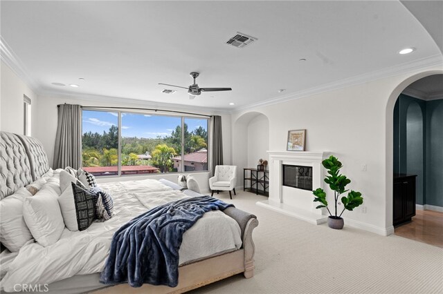 15020 Applewood Ct, San Diego, CA 92131 - bedroom with arched walkways, a glass covered fireplace, ornamental molding, carpet, and baseboards