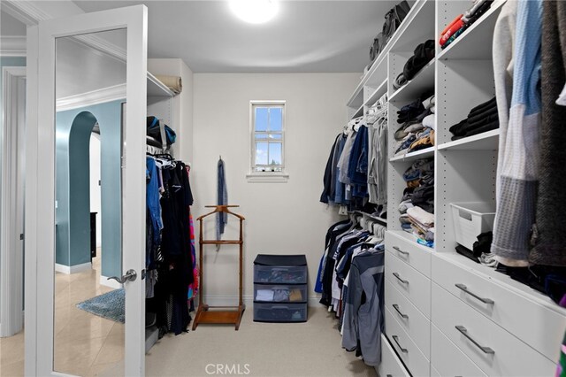 15020 Applewood Ct, San Diego, CA 92131 - spacious closet featuring arched walkways and light tile patterned flooring