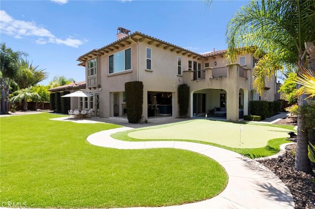 15020 Applewood Ct, San Diego, CA 92131 - rear view of property featuring a putting area, a balcony, a patio, stucco siding, and a chimney