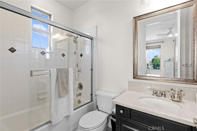 15020 Applewood Ct, San Diego, CA 92131 - full bath with vanity, plenty of natural light, toilet, and bath / shower combo with glass door