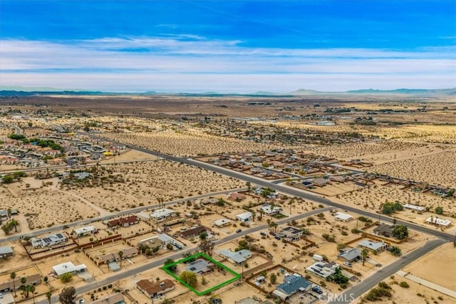 5799 Halsey Ave Unit 29, Palms, CA 92277 - aerial view of sparsely populated area with a desert landscape, mountains, and property parcel outlined
