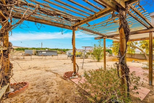 5799 Halsey Ave Unit 29, Palms, CA 92277 - view of yard featuring fence and a pergola