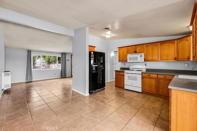 5799 Halsey Ave Unit 29, Palms, CA 92277 - kitchen with white appliances, brown cabinetry, a sink, a textured ceiling, and open floor plan