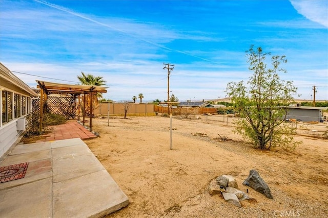 5799 Halsey Ave Unit 29, Palms, CA 92277 - fenced backyard with a patio and a pergola