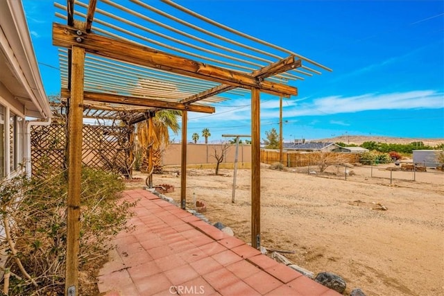 5799 Halsey Ave Unit 29, Palms, CA 92277 - view of patio featuring a pergola and a fenced backyard